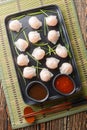 Traditional Asian Prawn or shrimp dumplings hakau, ha kauw or har gow served with sauce. Vertical top view Royalty Free Stock Photo