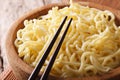 Traditional Asian ramen noodles in a bowl macro. horizontal