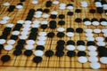 Traditional asian strategy board game. close up black and white stone, Desk for board game Go