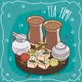 Traditional Asian sweets and masala chai tea