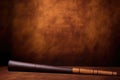 traditional australian didgeridoo propped against an earth-toned wall Royalty Free Stock Photo