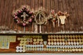 Dried flower arrangements for cattle drive and awards on metal badges for dairy cows attached to a wooden barn.