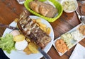 traditional Austrian dish of pork ribs with potatoes with an assortment of cheese spreads