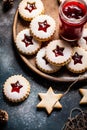 Traditional Austrian home baked Christmas cookies Linzer eyes with raspberry jam powdered