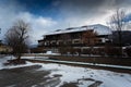 Traditional Austrian wooden house in Alps covered by snow Royalty Free Stock Photo