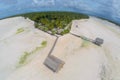 Traditional authentic overwater thatched roof bungalow of native local aborigines Micronesian people in atoll lagoon. Kiribati.