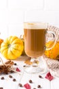 Traditional autumn dishes. Halloween, Thanksgiving. Mug of  hot and spicy aromatic pumpkin latte with whipped cream on top Royalty Free Stock Photo