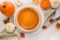 Traditional autumn food, pumpkin pie and colorful pumpkins Royalty Free Stock Photo