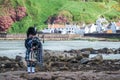 Traditional bagpiper in full dress code near Pennan Royalty Free Stock Photo