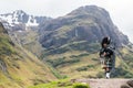 Traditional bagpiper in the scottish highlands Royalty Free Stock Photo