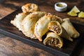 Traditional baked Argentine empanadas savoury pastries with beef stuffing.