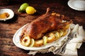 Traditional baked duck with apples and lemon on a dark wooden table Royalty Free Stock Photo