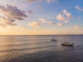 Traditional Balinese boat Jukung at Jimbaran beach at sunset in Royalty Free Stock Photo