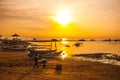 Traditional Balinese boats and pavilion in Sanur beach in the morning at dawn, Bali, Indonesia. Royalty Free Stock Photo