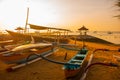 Traditional Balinese boats and pavilion in Sanur beach in the morning at dawn, Bali, Indonesia. Royalty Free Stock Photo