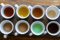 Traditional Balinese coffee and tea after testing on the wooden table in Ubud, island Bali, Indonesia , closeup