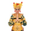Traditional Balinese dancer woman with gestures welcoming beside empty copyspace Royalty Free Stock Photo