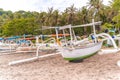 Traditional Balinese fisherman boats on a Virgin beach or Pasir Putih or Perasi Beach on Bali, Indonesia. Beautiful and clean