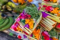 Traditional balinese handmade offering to gods on a morning market in Ubud. Bali island. Royalty Free Stock Photo