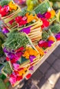 Traditional balinese handmade offering to gods on a morning market in Ubud. Bali island. Royalty Free Stock Photo