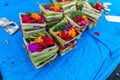 Traditional balinese handmade offering to gods on a morning market in Ubud. Bali island. Royalty Free Stock Photo