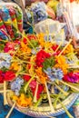 Traditional balinese handmade offering to gods on a morning market in Ubud. Bali island. Royalty Free Stock Photo