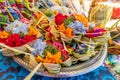 Traditional balinese handmade offering to gods on a morning market in Ubud. Bali island. Royalty Free Stock Photo