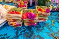 Traditional balinese handmade offering to gods on a morning market in Ubud. Bali island. Royalty Free Stock Photo
