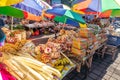 Traditional balinese handmade offering to gods on a morning market in Ubud. Bali island. Royalty Free Stock Photo