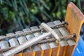 Traditional Balinese musical percussion instrument - xylophone Jegog with hammer, part of orchestra Gamelan. Arts, Music and Royalty Free Stock Photo