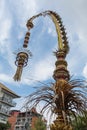Traditional balinese penjors along the street of Bali, Indonesia. Tall bamboo poles with decoration are set in honour of