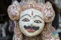 Traditional Balinese stone statuette of the deity in the street temple. Island Bali, Indonesia . Closeup