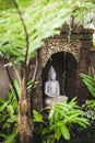 Traditional balinese style hindu statue as decoration in hotel garden.