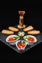 Traditional Balkan relish - lutenica, served with herbs, cheese and rusk Royalty Free Stock Photo