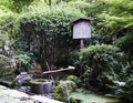 Traditional bamboo fountain at Ryoanji temple Royalty Free Stock Photo