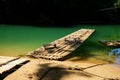 Traditional bamboo raft floats over the clear river in the morning Royalty Free Stock Photo