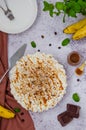 Traditional Banoffee pie with fresh bananas, whipped cream, chocolate, coffee and toffee. No baking dessert. Vertical orientation