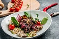 Traditional barbecue skirt steak sliced with salad grilled vegetables, nuts, sauce. Food recipe background. Close up Royalty Free Stock Photo