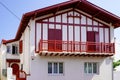 Traditional bask home white red facades of a house in southwest in basque country France Royalty Free Stock Photo