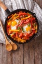 Traditional Basque piperade with eggs close-up. vertical top vie Royalty Free Stock Photo