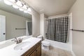 Traditional bathroom interior with checkered black and white shower curtain Royalty Free Stock Photo
