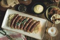 Traditional Bavarian Grilled Sausages with Cabbage Salad, Mustard and Beer Royalty Free Stock Photo