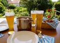 traditional Bavarian meal: white sausages, salty pretzels, sweet mustard, German beer and basket of prezels on Bavarian napkin Royalty Free Stock Photo