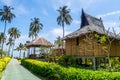 Traditional beach bungalows and coconut palms on Koh Phi Phi isl Royalty Free Stock Photo