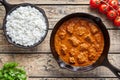 Traditional Beef Madras curry Indian spicy lamb food with rice in cast iron pan