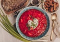 Ukrainian and Russian traditional beet soup borsh with sour cream in a bowl. Close-up and rustic style Royalty Free Stock Photo