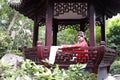 Chinese opera woman.Practicing Peking Opera in the Pavilion garden, Colorful, china Royalty Free Stock Photo