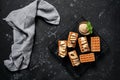 Traditional Belgian waffles with banana and ice cream on a black grunge background. Flat lay, top view