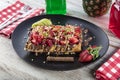 Traditional Belgian waffles with fresh fruit and whipped cream Royalty Free Stock Photo