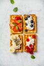 Traditional belgian waffles with whipped cream and fresh fruits Royalty Free Stock Photo